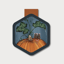  A picture of two cute mice sitting on an orange pumpkin in the rain on a hexagon shaped magnetic bookmark